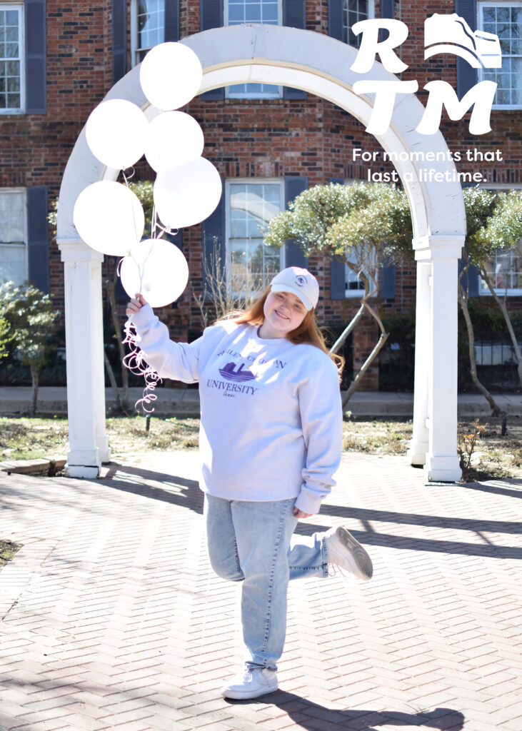 girl holding balloons
